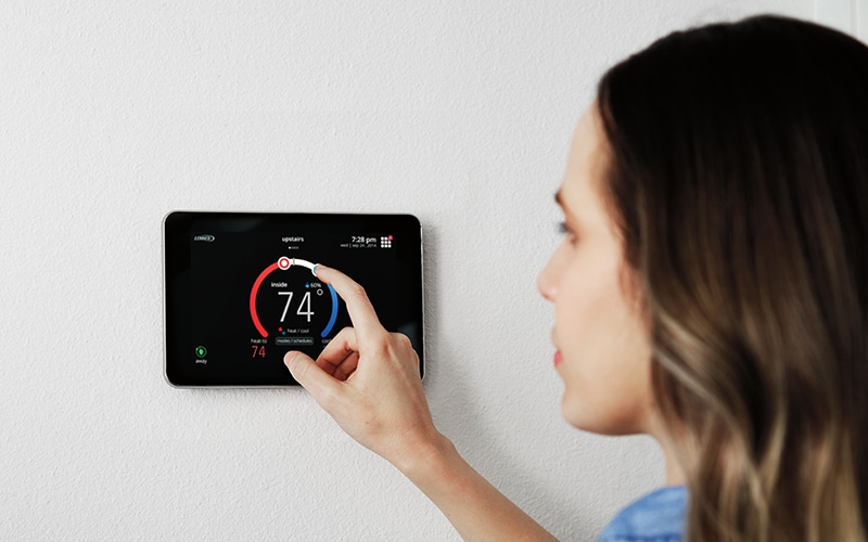 A women changing home temperature